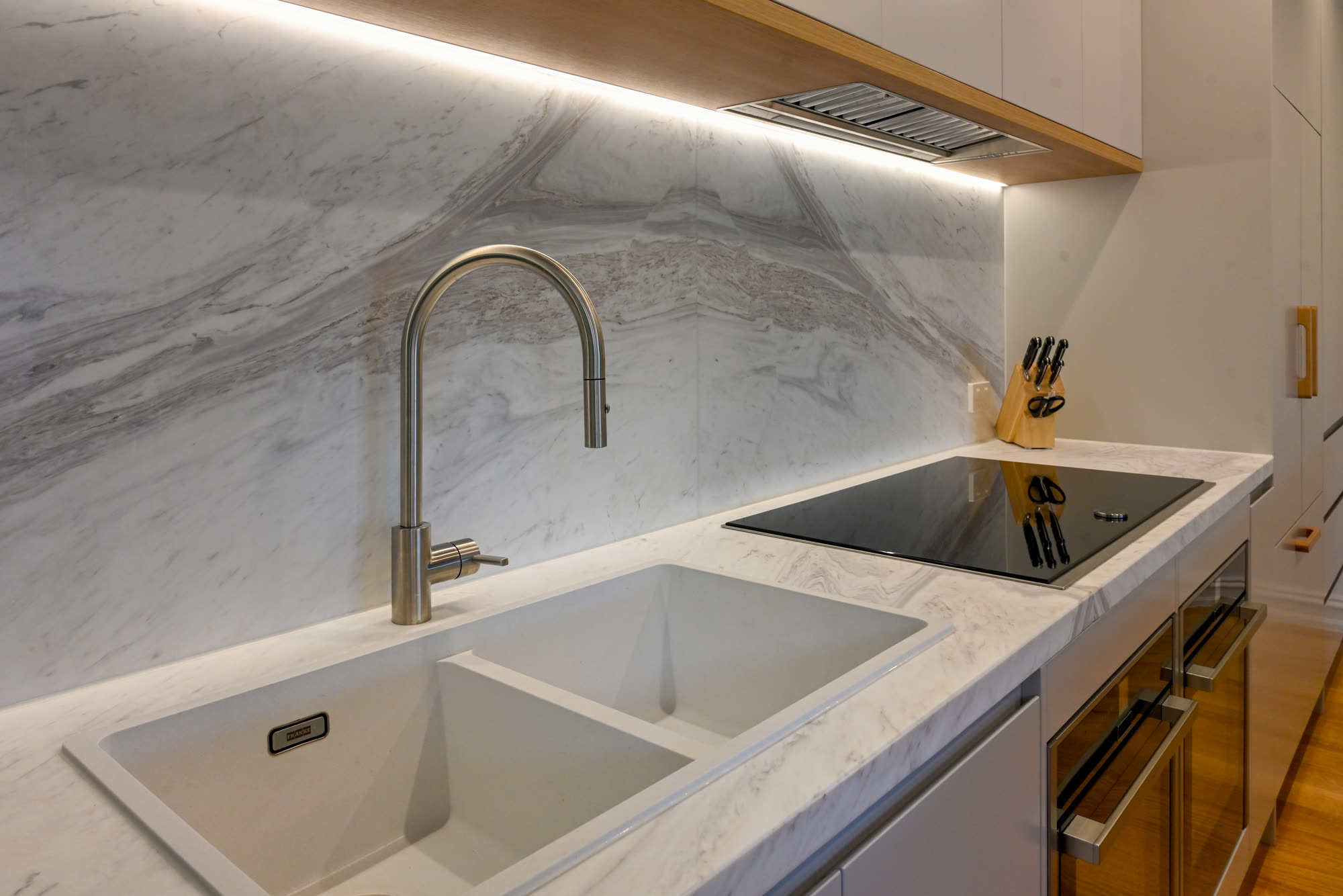 Marble benchtop, sink and cooktop detail